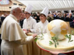 Pope Francis was given a globe adorned with olive branches. Image of Pope Francis was given a globe adorned with olive branches.