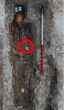 The grave of Sk27 has one notable artifact, a scallop shell which told researchers he was a religious pilgrim. Image of The grave of Sk27 has one notable artifact, a scallop shell which told researchers he was a religious pilgrim.
