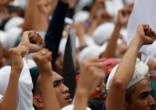 Angry Muslims protested the Catholic church's construction. Image of Angry Muslims protested the Catholic church's construction.