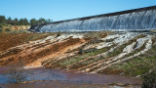 Excessive Drain Flow 'Jetting' from Sidewall Outlets signal Alarm in Spillway Slab Cracks & Poor Sealing of Slab seams. Image of Excessive Drain Flow 'Jetting' from Sidewall Outlets signal Alarm in Spillway Slab Cracks & Poor Sealing of Slab seams.