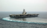The aircraft Carrier Ronald Reagan (CVN76) performs a turn at sea. The U.S.S. Carl Vinson (CVN 70) is keeping the peace in the Western Pacific at this time. Image of The aircraft Carrier Ronald Reagan (CVN76) performs a turn at sea. The U.S.S. Carl Vinson (CVN 70) is keeping the peace in the Western Pacific at this time.