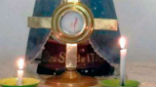 A host appears to bleed during adoration in Argentina. Photo - AICA Image of A host appears to bleed during adoration in Argentina. Photo - AICA