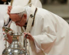 Pope Francis inspects a jar of holy oil during the Chrism Mass. Image of Pope Francis inspects a jar of holy oil during the Chrism Mass.