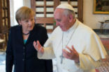 Pope Francis shares a teaching moment with Chancellor Merkel. Image of Pope Francis shares a teaching moment with Chancellor Merkel.