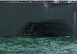The USS John S. McCain suffers significant damage after a collision with a Liberian-flagged oil tanker. Image of The USS John S. McCain suffers significant damage after a collision with a Liberian-flagged oil tanker.