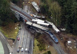 The Amtrak train was traveling 49 MPH in excess of the speed limit when it hit a curve and derailed on a bridge over the Interstate 5 freeway. Image of The Amtrak train was traveling 49 MPH in excess of the speed limit when it hit a curve and derailed on a bridge over the Interstate 5 freeway.