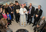 Bishop Burbige blesses the new clinic. Image of Bishop Burbige blesses the new clinic.