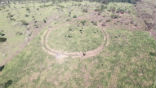 The site of an abandoned village, centuries old, surrounded by earthworks. Image of The site of an abandoned village, centuries old, surrounded by earthworks.