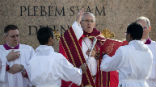 Pope Francis blesses the audience during Palm Sunday Mass. Image of Pope Francis blesses the audience during Palm Sunday Mass.