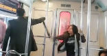An allegedly possessed woman strikes at a man attempting an exorcism on her. Image of An allegedly possessed woman strikes at a man attempting an exorcism on her.