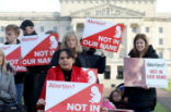 Pro life campaigners gather with placards at Parliament buildings on the Stormont Estate in Belfast Image of Pro life campaigners gather with placards at Parliament buildings on the Stormont Estate in Belfast
