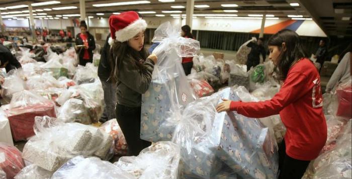 Students working with toy donations during Christmas