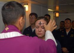 Priest applying ashes