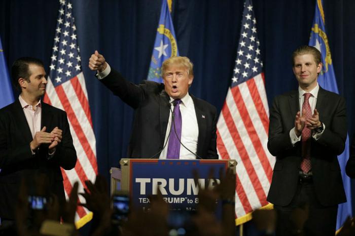 Donald Trump stands with his sons Don Jr. and Eric to deliver his victory speech. Donald Trump stands with his sons Don Jr. and Eric to deliver his victory speech.