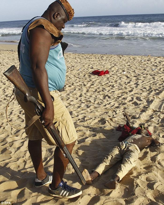 A man views the body of a slain tourist. A man views the body of a slain tourist.