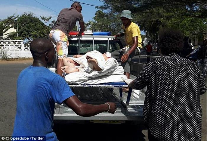 An injured person is loaded into a vehicle for a ride to the hospital. An injured person is loaded into a vehicle for a ride to the hospital.
