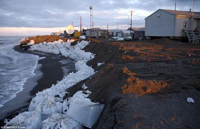 An Inuit village must now rely on sandbags to prevent erosion of their island home. For hundreds of years, until now, ice provided the protection they needed. An Inuit village must now rely on sandbags to prevent erosion of their island home. For hundreds of years, until now, ice provided the protection they needed.