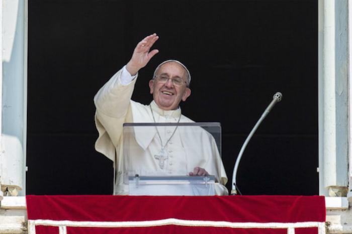 Pope Francis greets the crowd gathered in St. Peter Pope Francis greets the crowd gathered in St. Peter