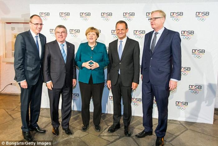 German Chancellor Angela Merkel seen flashing the sign. German Chancellor Angela Merkel seen flashing the sign.
