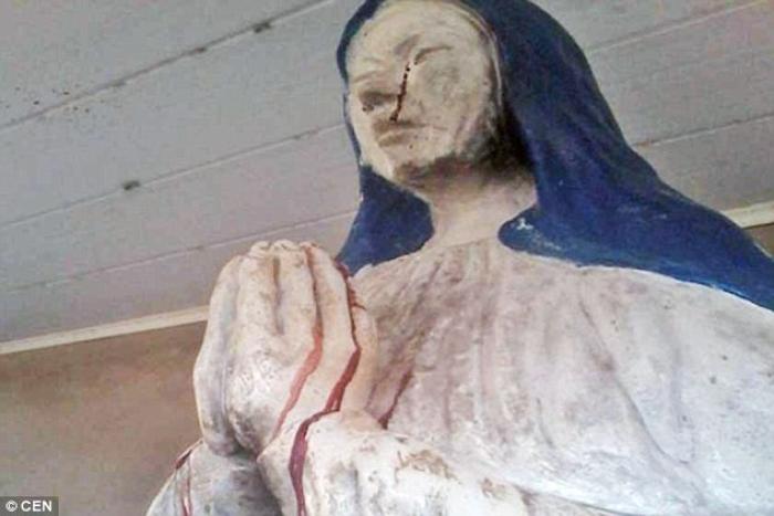 A picture of the weeping statue of the Virgin Mary. Parishioners say she is weeping blood.