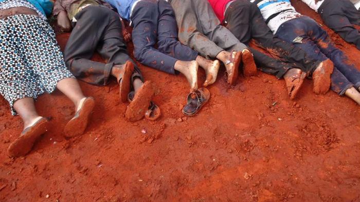 The bodies of some victims were lined up in the dirt. The bodies of some victims were lined up in the dirt.