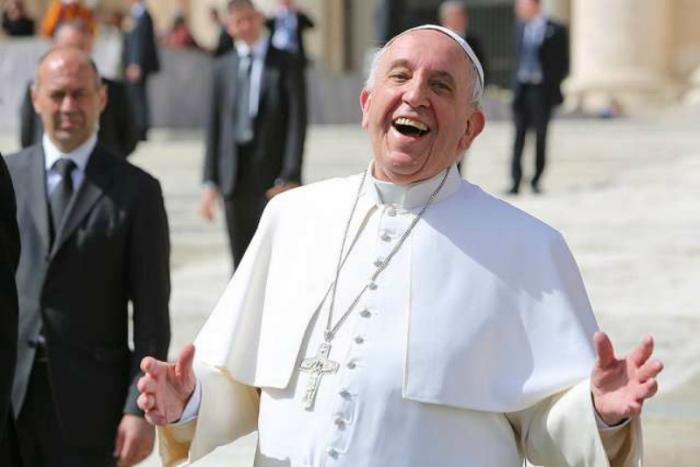 Pope Francis laughing outside of St. Peter's Basilica. Pope Francis laughing outside of St. Peter's Basilica.