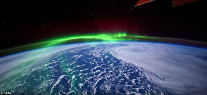 The northern lights are visible above the Arctic Circle. 
