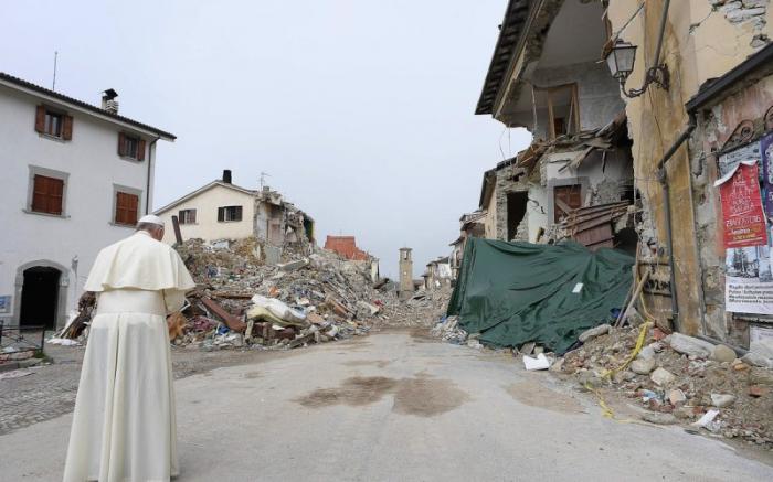 Pope Francis prays as he visits the earthquake-ravaged town of Amatrice, Italy.