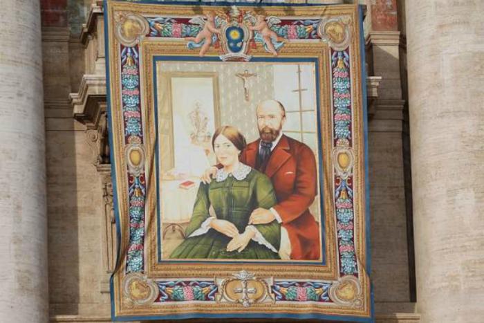 A Vatican tapestry of Louis and Zelie Martin, who were canonized in St. Peter's Square.