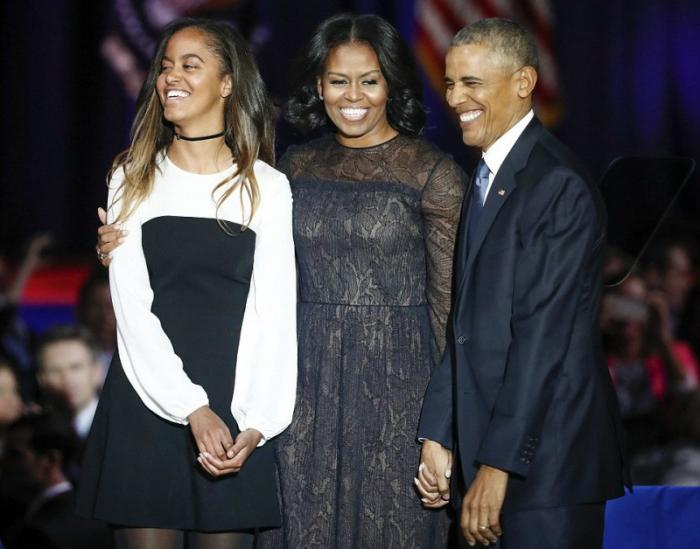 The Obamas smile together following the President's farewell address