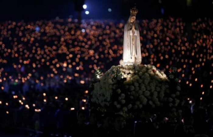 A statue of Our Lady of Fatima is carried through the crowd May 12 at the Marian shrine of Fatima in central Portugal.