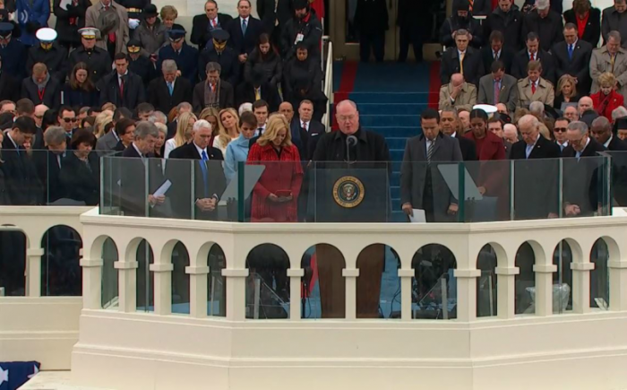 Fr. Dolan prays during the inauguration ceremony.