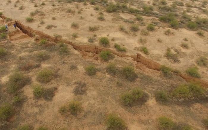 The giant fissure splits the desert's surface in Tator Hills of Pinal County.