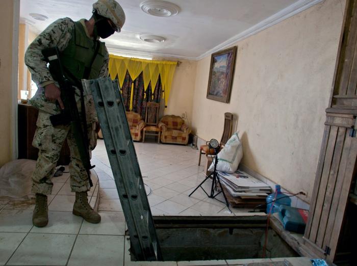 Drug tunnels usually run between houses with doors in the floor, or concealed behind heavy, unusual objects such as fireplaces. 