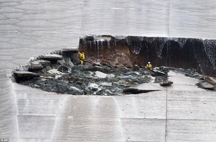 A close up provides a sense of scale. The hole in the spillway is simply massive. A close up provides a sense of scale. The hole in the spillway is simply massive.