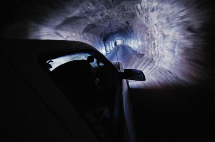 Workers descend through a mine shaft toward the caverns of Naica mine. Workers descend through a mine shaft toward the caverns of Naica mine.