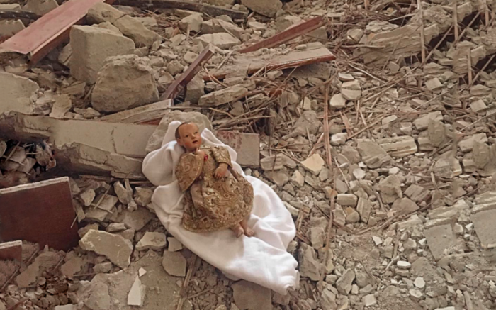 The Christ Child lies amid the rubble of the monastery in Camerino, Italy. The Christ Child lies amid the rubble of the monastery in Camerino, Italy.