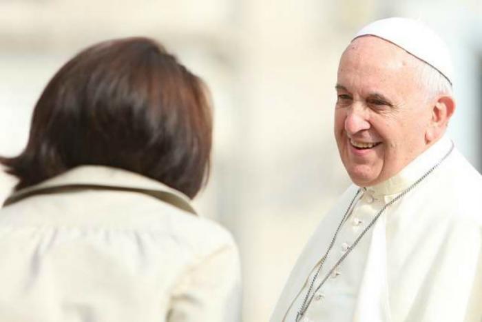 Pope Francis greets pilgrims in St. Peter's Square.