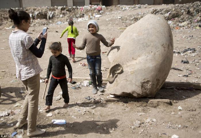 The crown rested in a public space until it could be safely moved away, giving locals an opportunity to have their picture taken next to an artifact from antiquity. 