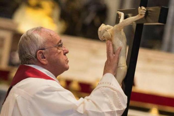 Pope Francis venerates the cross on Good Friday.
