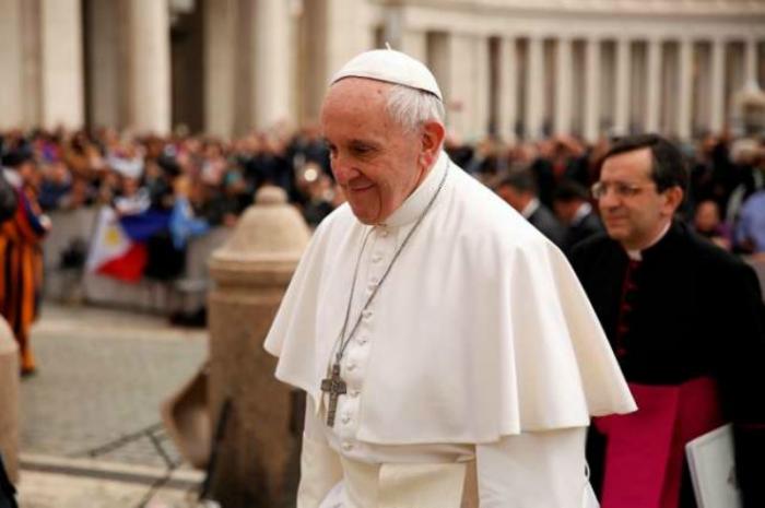 Pope Francis arrives to his March 22, 2017 general audience in St. Peter's Square.