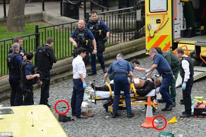 The terrorist is loaded into an ambulance. He later died from his injuries. The terrorist is loaded into an ambulance. He later died from his injuries.