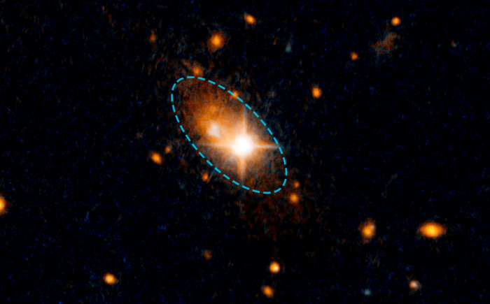 The smudge is a quasar, ejected from its normal spot in the heart of the galaxy. A quasar is believed to be made of a supermassive black hole and the dust and gas around it, accelerated to relativistic speeds and giving off enormous energy. 