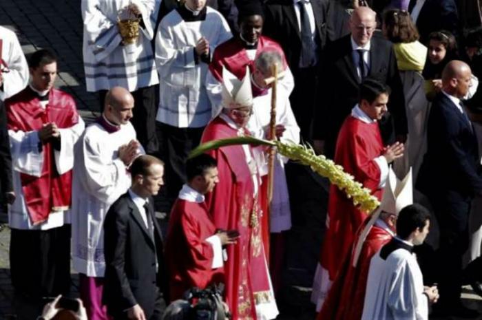 Pope Francis blesses palms during Palm Sunday Mass in St. Peter's Square.