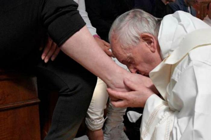Pope Francis kisses the feet of an inmate at Paliano prison during Holy Thursday Mass April 13. Pope Francis kisses the feet of an inmate at Paliano prison during Holy Thursday Mass April 13.