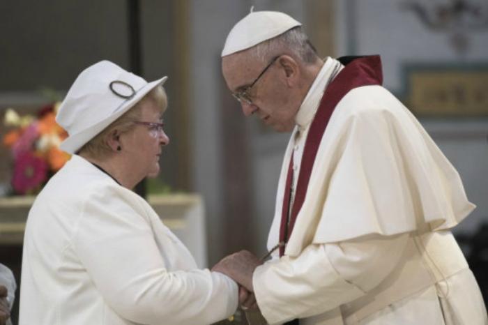 Pope Francis comforts Roselyne Hamel.