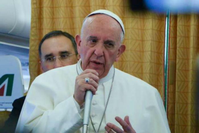 Pope Francis aboard the papal plane on April 29, 2017.` Pope Francis aboard the papal plane on April 29, 2017.`