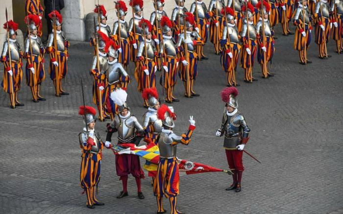 The men were sworn into the Swiss Guard with an ancient ceremony. The men were sworn into the Swiss Guard with an ancient ceremony.
