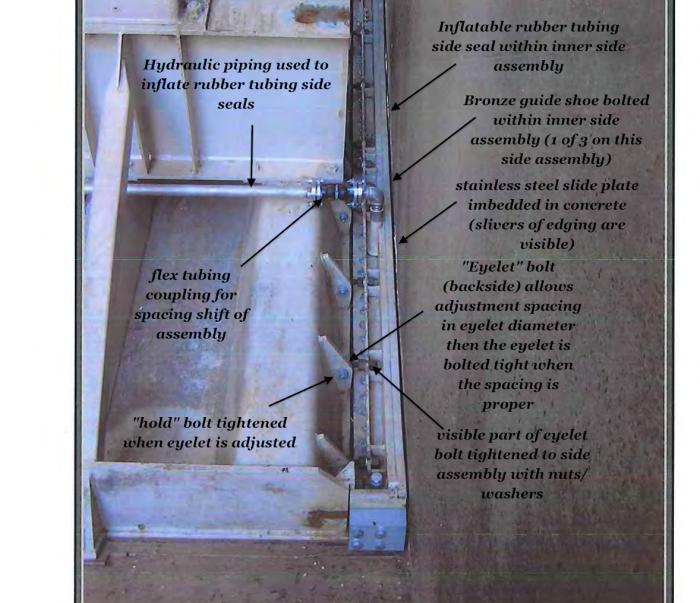 Fig 1. DSOD Inspection photograph of 'alignment bolts' that secure the Side Seal Assembly and are intended to maintain a precise alignment gap during the operation of the heavy approx 20 to 30 ton Radial Gates. This image reveals a better alignment, or minimal offset, of the welded radial gate mounting flanges/plates. Other Gates have very large offsets of these mounting points with respect to the bolt holes in the Side Seal Assembly - thus creating the 'fix' extensions and spacers employed by DWR. The base design is a poor design as torsional or operational side forces may 'shift' the eyelet at the 'hold bolt' - thus opening a gap for mud and debris to wedge into while in flow conditions. Fig 1. DSOD Inspection photograph of 'alignment bolts' that secure the Side Seal Assembly and are intended to maintain a precise alignment gap during the operation of the heavy approx 20 to 30 ton Radial Gates. This image reveals a better alignment, or minimal offset, of the welded radial gate mounting flanges/plates. Other Gates have very large offsets of these mounting points with respect to the bolt holes in the Side Seal Assembly - thus creating the 'fix' extensions and spacers employed by DWR. The base design is a poor design as torsional or operational side forces may 'shift' the eyelet at the 'hold bolt' - thus opening a gap for mud and debris to wedge into while in flow conditions.