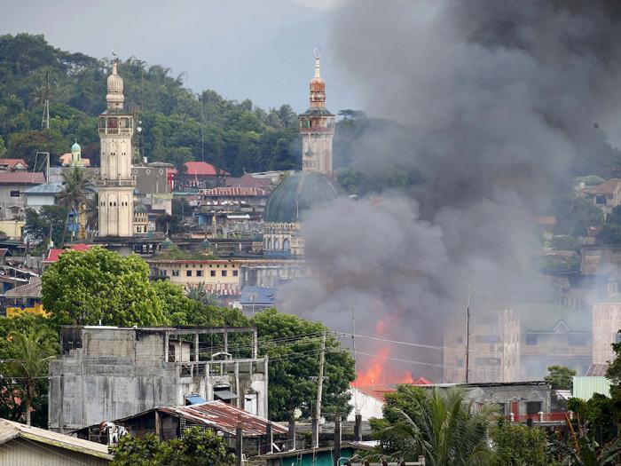 A structure that was once a strongpoint for terrorists burns in Marawi following an airstrike. The military continues to crush the terrorists, although slowly and methodically. A structure that was once a strongpoint for terrorists burns in Marawi following an airstrike. The military continues to crush the terrorists, although slowly and methodically.